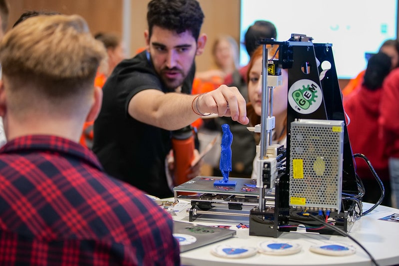 A student demonstrating their project at iGEM