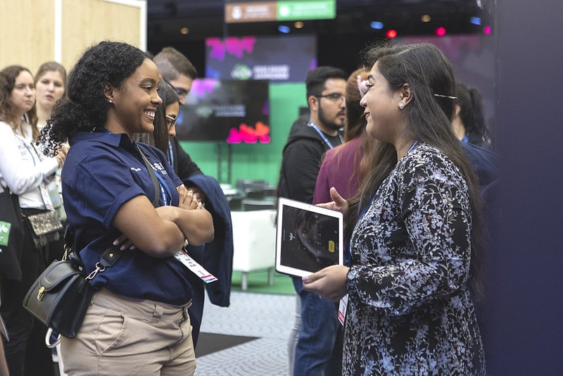 Two students discussing their project at iGEM