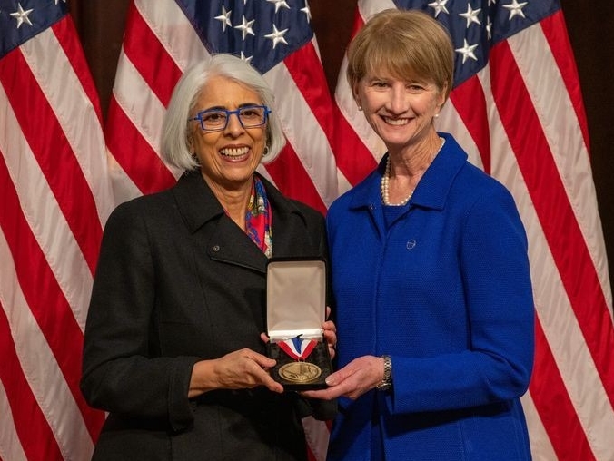 Arati Prabhakar, Ph.D., Director of the White House Office of Science and Technology Policy (OSTP), awards Kristina M. Johnson the National Medal of Technology and Innovation during an awards ceremony at the Eisenhower Executive Office Building in Washington, DC, January 3, 2025. 