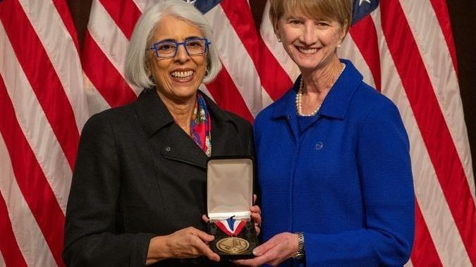 Arati Prabhakar, Ph.D., Director of the White House Office of Science and Technology Policy (OSTP), awards Kristina M. Johnson the National Medal of Technology and Innovation during an awards ceremony at the Eisenhower Executive Office Building in Washington, DC, January 3, 2025. 